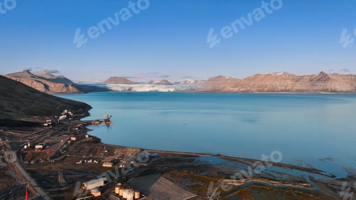 Preview: Stunning view of Pyramiden in Svalbard showcasing mountains and serene blue waters
