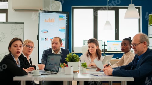 Preview: Pov of diverse team sitting in conference room during virtual meeting