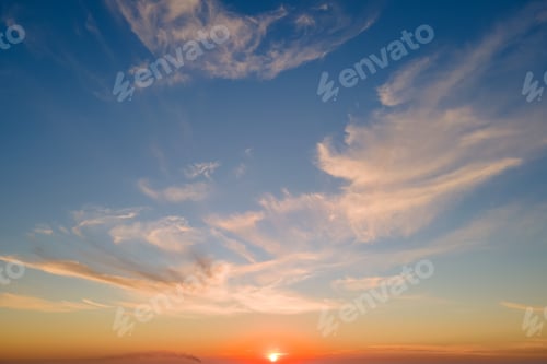 Preview: Bright colorful sunset sky with rays of setting sun and vivid dark clouds