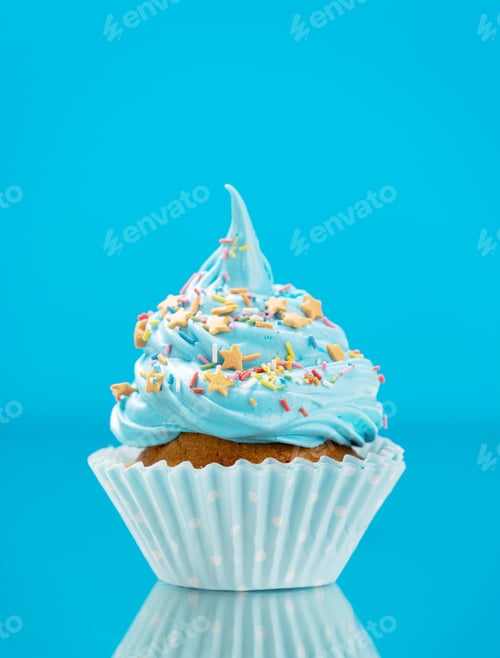 Preview: Festive Cupcake with Blue Frosting and Star Sprinkles