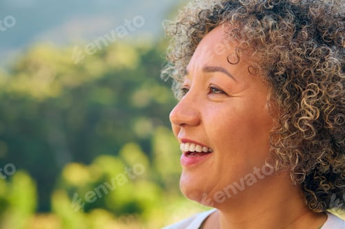 Preview: Close Up Portrait Of Laughing And Smiling Mature Woman Standing Outdoors In Countryside