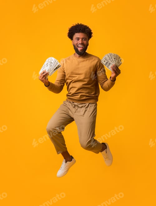 Preview: Super happy afro guy celebrating victory, holding lot of money