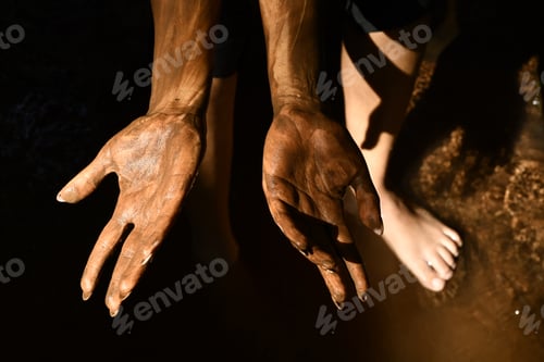Preview: Closeup of female hands in the sand on a beach