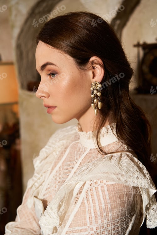 Preview: Elegant young woman showcasing vintage fashion in a stylish interior setting
