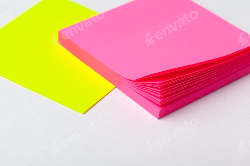 Preview: Sticky notes of bright colors close up on paper background. School or business concept