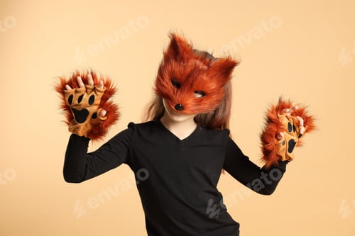 Preview: Quadrobics. Girl wearing fox mask and gloves on beige background