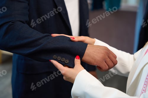 Preview: Fitting the navy suit jacket in a tailor shop