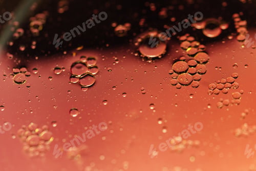 Preview: oil with bubbles on orange background. Abstract space background.