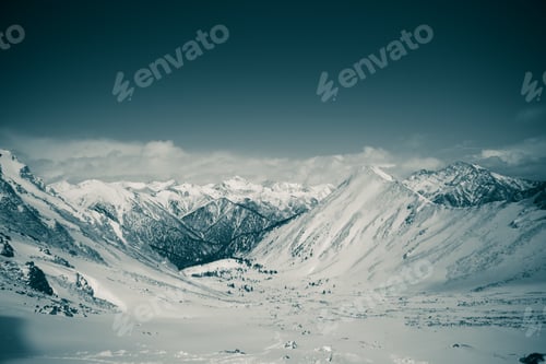 Preview: Snowy Mountains Landscape with Rolling Clouds