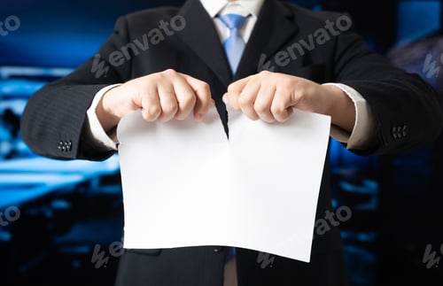 Preview: Businessman tearing a blank sheet of paper