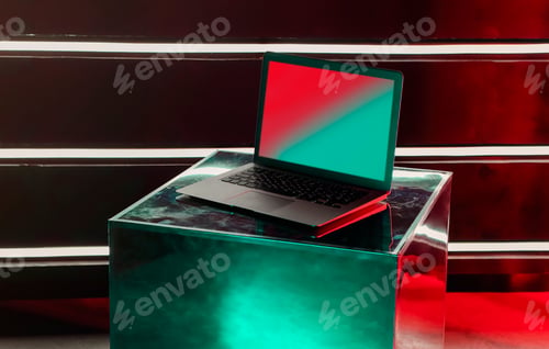 Preview: Modern laptop computer on creative designer metallic shiny cube
