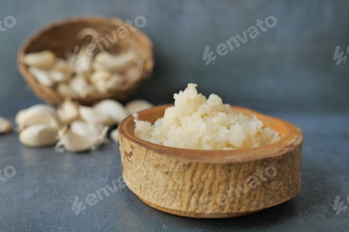 Preview: close up of minced garlic on a wooden spoon