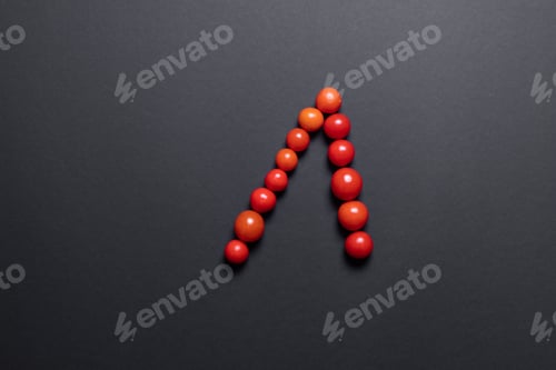 Preview: Arrows up of tomatoes, Creative food. Black background