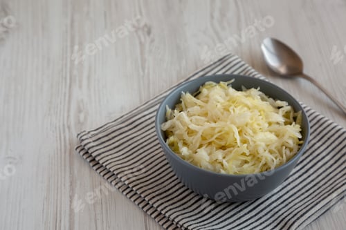 Preview: Homemade German Sauerkraut in a Bowl, side view. Copy space.