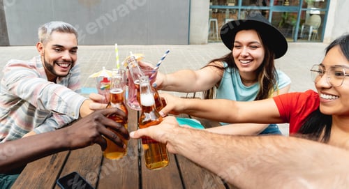 Preview: Young friends having fun during happy hour drinking beer at brewery bar restaurant