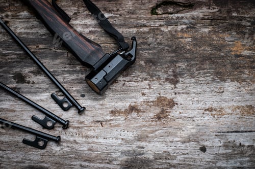 Preview: Tent peg nail iron hammer handle is made of ebony wood on old wooden background