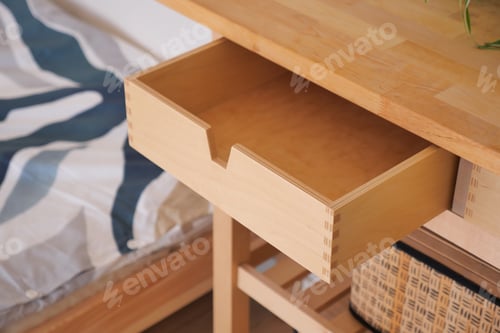 Preview: Wooden desk with open drawer in a cozy bedroom setting