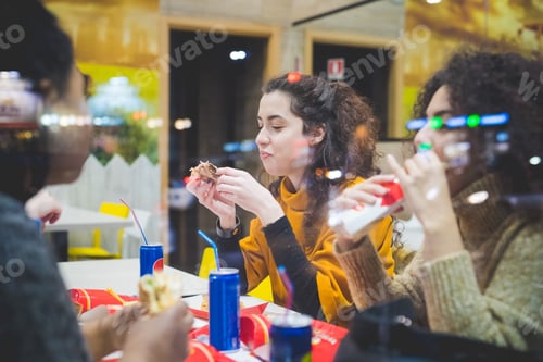 Preview: close up of women eating in fast food