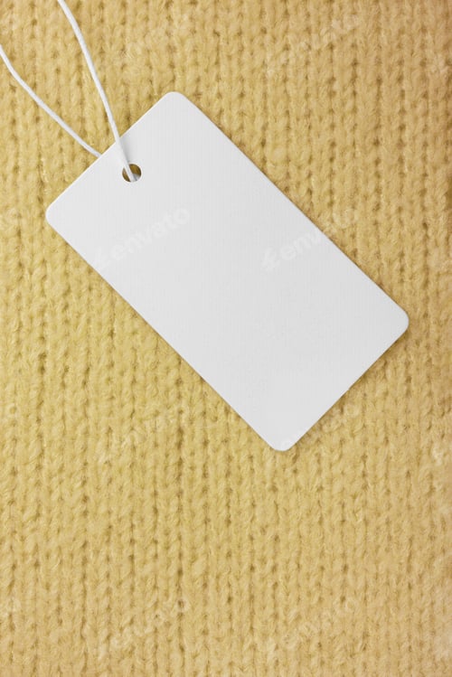 Preview: Template Of Blank Clothing Label, Price Tag On Yellow Knitted Sweater Background
