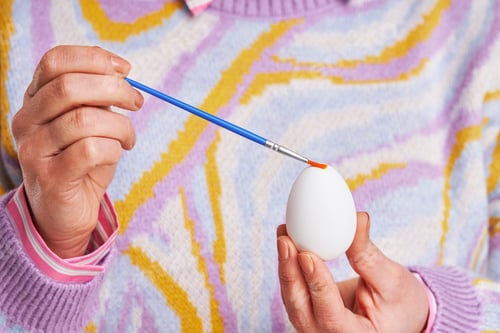 Preview: Studio shots of woman over yellow background easter style