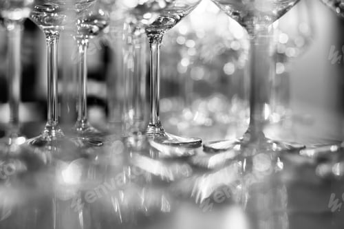 Preview: Selective focus shot of the stem of a glass wine with a blurred background