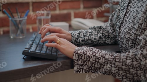 Preview: Close up of employee using keyboard to work on computer
