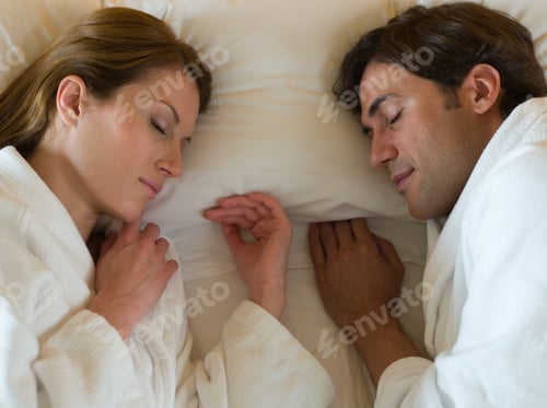 Preview: Couple sleeping in bed