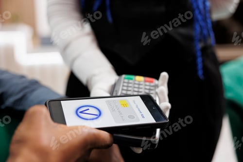 Preview: Customer using NFC payment app to pay