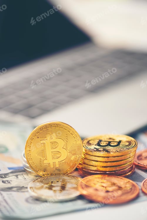 Preview: Physical version of Bitcoin (new virtual money) and banknotes of dollar. Exchange bitcoin