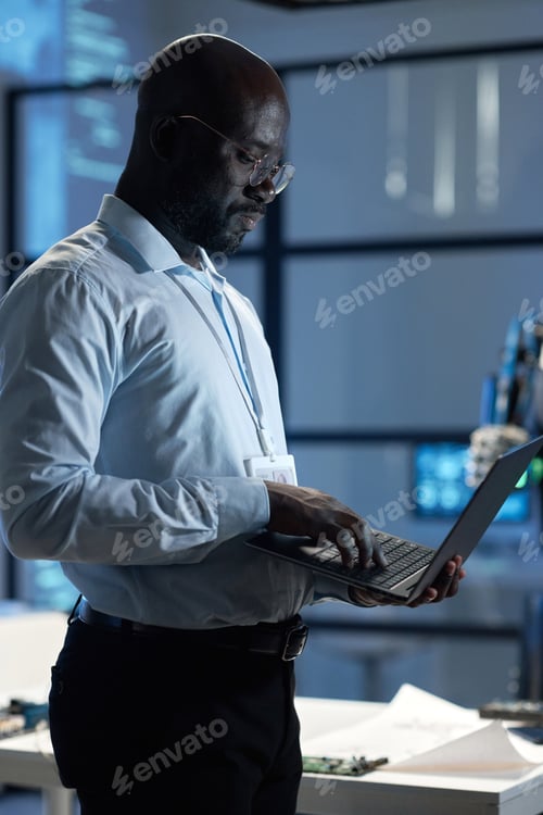 Preview: Engineer using laptop at his work
