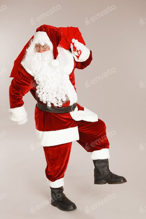 Preview: Authentic Santa Claus with bag full of gifts on grey background