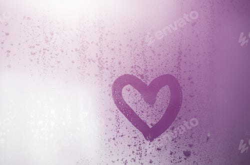 Preview: The heart is painted on the misted glass in winter