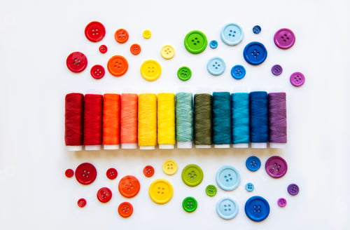 Preview: Spools of thread and buttons on the colors of the rainbow