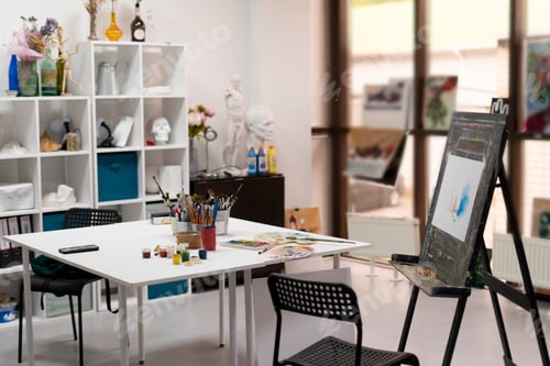 Preview: the artist's workplace in the studio with different paints and brushes