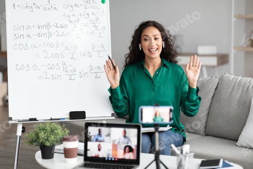 Preview: Math teacher showing board, giving virtual lecture to students
