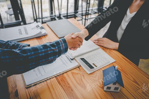 Preview: Handshake real estate agents deliver sample homes to customers. mortgage loan agreement Make a contr