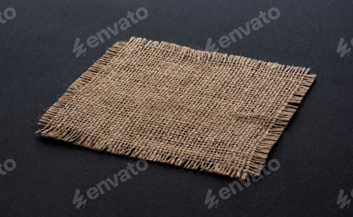 Preview: Old burlap fabric napkin on black background