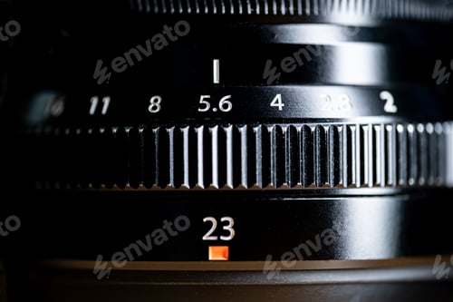 Preview: Close-up of camera lens with aperture and focal length settings