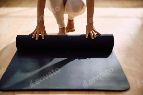 Preview: Close up of woman preparing for Yoga workout.