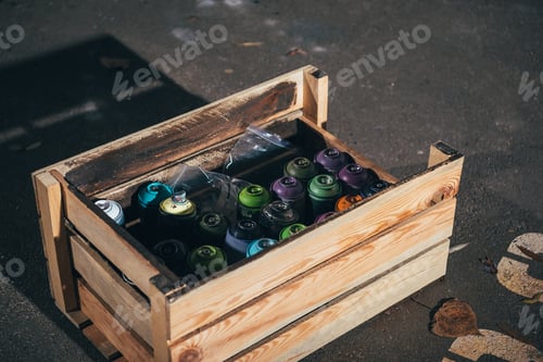Preview: cans with aerosol paint in wooden box