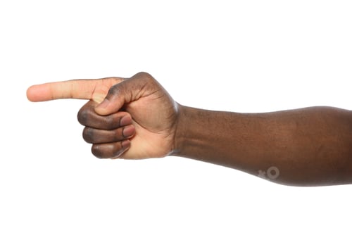 Preview: African-American man pointing at something on white background, closeup