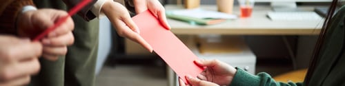 Preview: Young Asian Businessmen and Businesswomen Exchanging Documents in Office