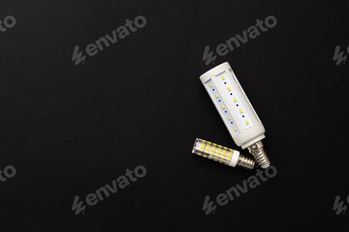 Preview: Compact light bulb isolated on black background