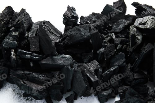 Preview: top view of black coals on white background