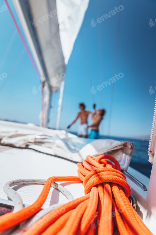 Preview: Two guys working on sailboat