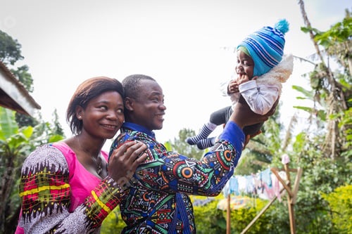 Preview: A united and happy African family, the father lifts his newborn son and the mother looks at him