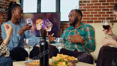 Preview: Guests laughing and talking at house gathering after offering host presents