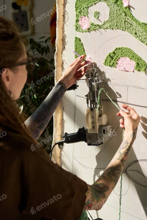 Preview: Young Adult Woman Operating Tufting Gun Creating Carpet Artwork