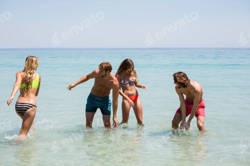 Preview: Cheerful young couples enjoying in sea