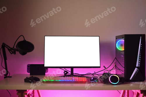 Preview: Modern gaming computer with mouse, microphone and headphones on table with neon light